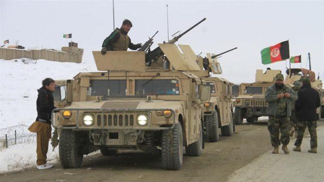 Afghan soldiers prepare to reach the scene of a plane crash near Ghazni on Monday [Sayed Mustafa/EPA-EFE]