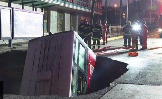 Six killed as ground swallows bus in China