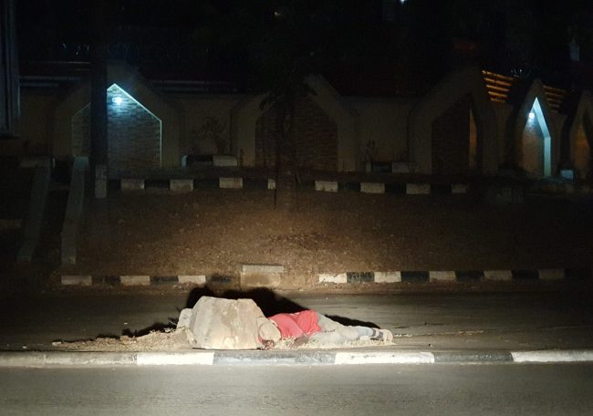 Man sleeps on the street in Abuja