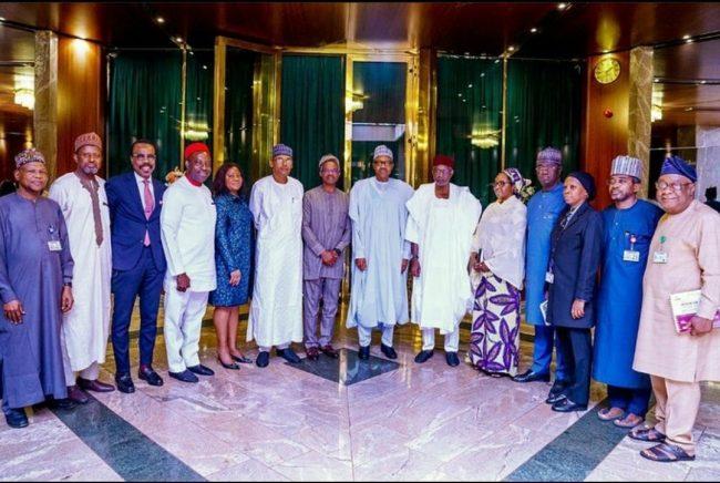 President Buhari in a group photograph with members of his economic team