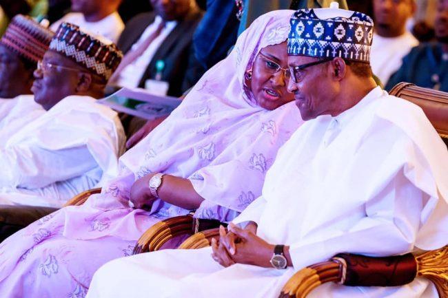 President Muhammadu Buhari and his wife Aisha at the conference