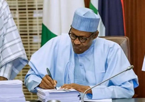 President Muhammadu Buhari signing budget in a file photo