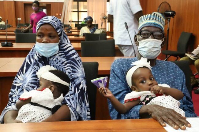 The twins and their parents after the operation