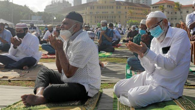 People praying - salat salah outside the mosque in Durban South Africa