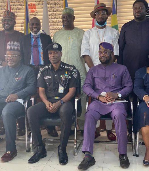 Stakeholders-on-police-reform-with-IGP-Mohammed-Adamu-and-DBanj-standing behind