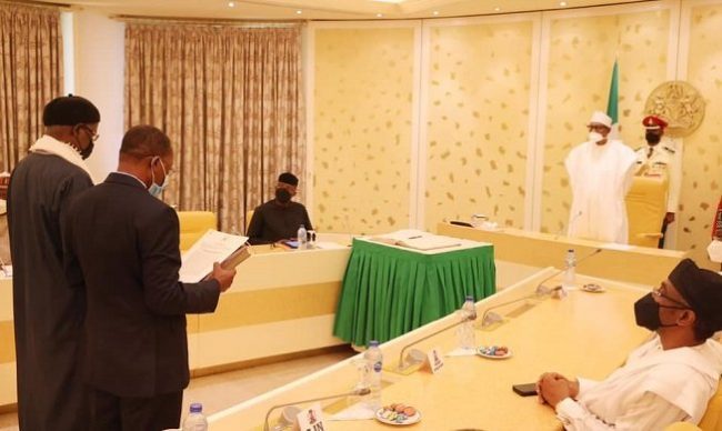 Buhari swears in 2 new INEC commissioners