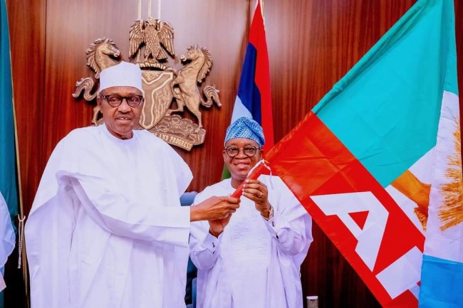 Osun election: Buhari presents APC flag to Oyetola