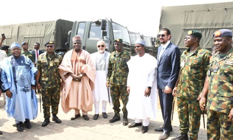 FG unveils troops-carrying vehicles as Defence minister hails Buhari